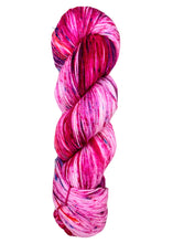 Multicolored skein of yarn on a white background baah yarn La Jolla fingering weight 